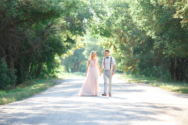 istock wedding couple on the nature in summer day. 1059202694