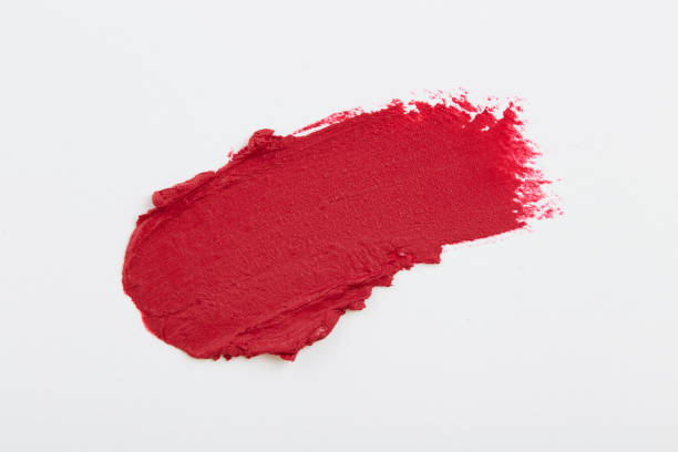 istock Smudged red lipstick on white background 1059204628