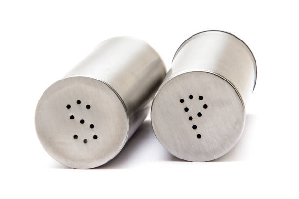 istock Metal salt and pepper shaker on white background 1059204722