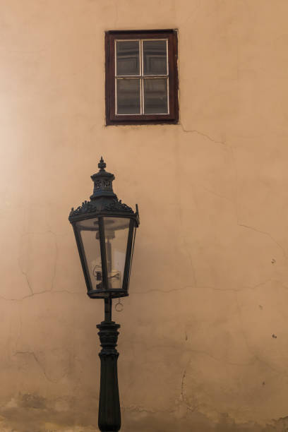 istock Street lamp - lantern and a window 1059205018