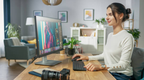 istock Professional Female Photographer Works in Photo Editing App / Software on His Personal Computer. Photo Editor Retouching Photos of Beautiful Girl. Mock-up Software Design. 1059208510