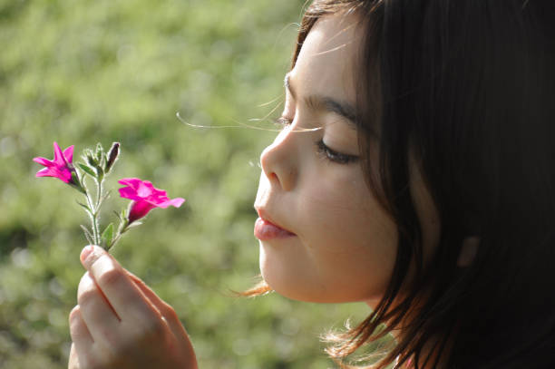 istock girl with flower 1059209298
