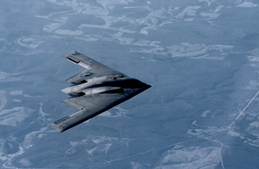 A KC-10A Tanker from McGuire Air Force Base, New Jersey refuels the Northrop B-2 Stealth Bomber over the Midwestern U.S. on March 27, 2001. The Northrop B-2 Stealth Bomber is a low-observable, strategic, long-range, heavy bomber capable of penetrating sophisticated and dense air-defence shields. Photo by Gary Ell
