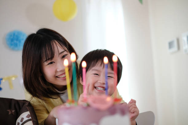 istock Mother celebrating her son's birthday at home 1059216574
