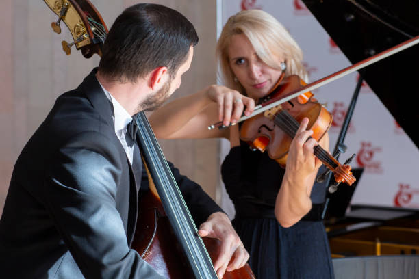 istock Musicians play the violin and contrabass 1059216670