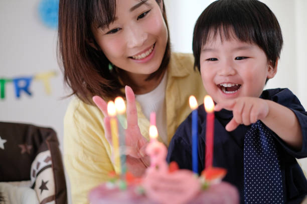 istock Mother celebrating her son's birthday at home 1059216968