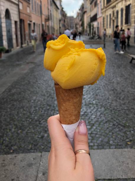 istock Gelato: Italian ice cream in female hand 1059217812