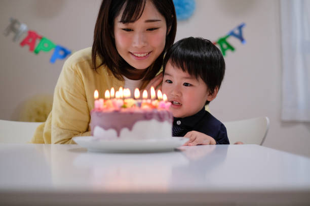 istock Mother celebrating her son's birthday at home 1059218510