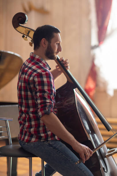 istock Double bass player playing contrabass 1059218976