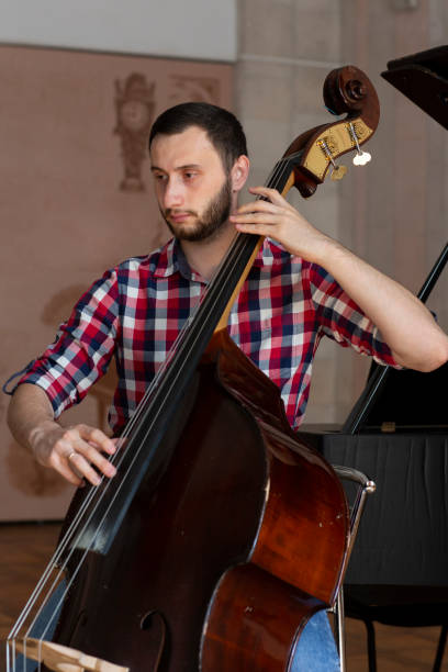 istock Double bass player playing contrabass 1059220420
