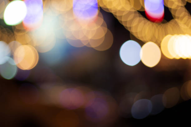 istock Abstract background of colorful bokeh lights with defocused effe 1059221584