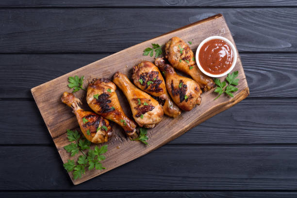 istock Grilled chicken legs with tomato sauce 1059223692