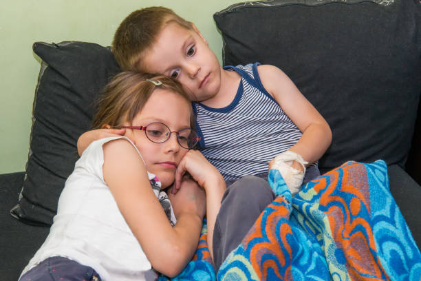 istock Brother and sister watch TV 1059227164