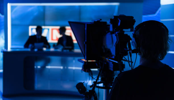 Newsreaders In Television Studio Newsreaders In Television Studio broadcasting stock pictures, royalty-free photos & images