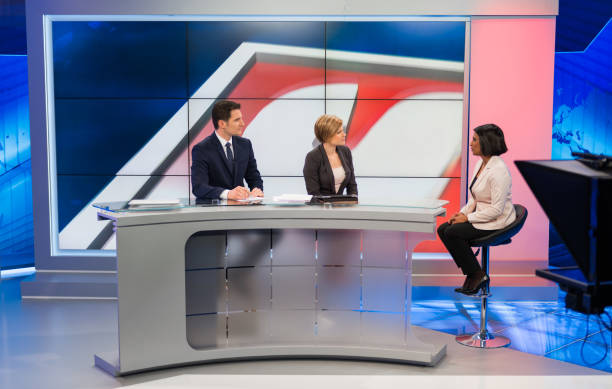 istock Journalists Sitting With Businesswoman 1059228166