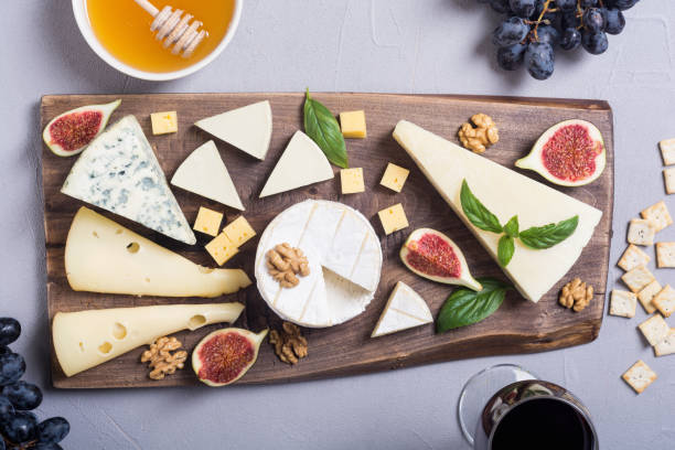 istock Cheeseboard with cheese brie , parmesan , camembert and dorblu 1059230428