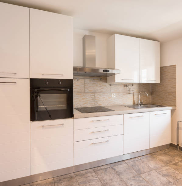 istock White kitchen with black oven and tiles 1059234668