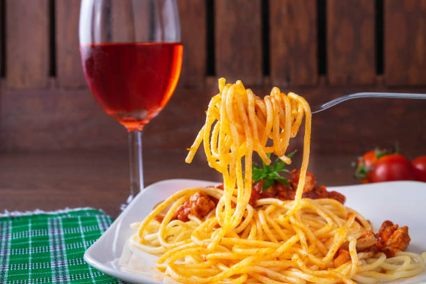 istock Spaghetti and Italian pasta with wine on table 1059234724