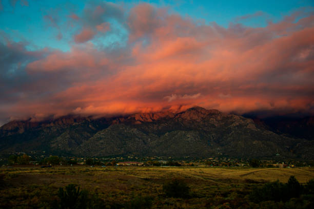 istock Sandia Mountains with Majestic Sky and Clouds at Sunset 1059234928