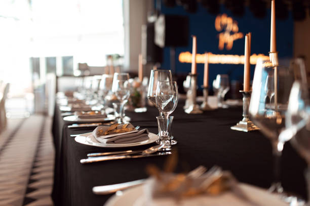 istock Sparkling glassware stands on table prepared for wedding. Wedding decor, interior. Festive. Banquet table 1059235108