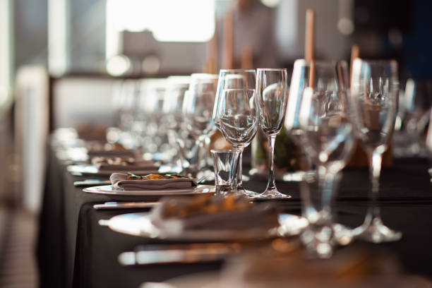 istock Sparkling glassware stands on table prepared for wedding. Wedding decor, interior. Festive. Banquet table 1059236590
