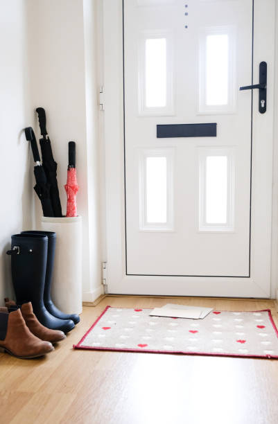 istock Front of a typical English home with mails on the floor 1059238476