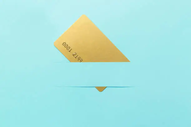 Gold card mockup, on a blue background, creative concept idea. Copy space