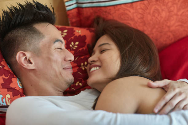 istock Romantic couple lying together on bed. 1059244812