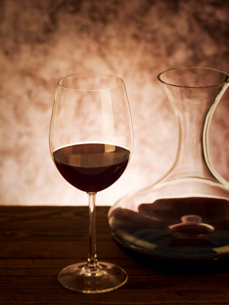 istock Decanter with red wine and glass on table 1059245122
