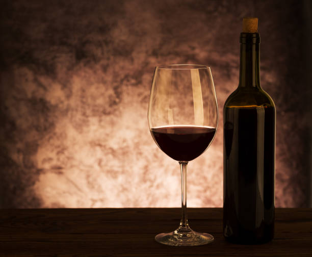 istock Glass with Red Wine on wooden background 1059245208