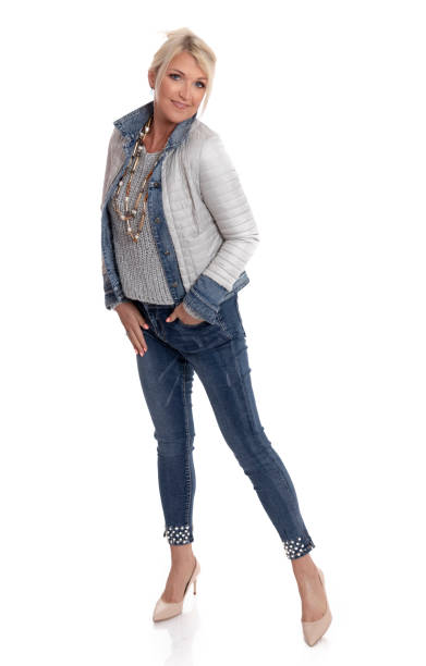 istock Fashionable female model posing in jeans 1059248858