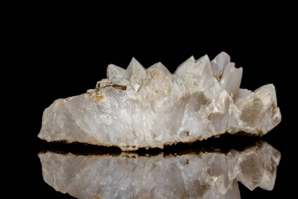 istock Macro mineral stone Snow quartz with calcite on a black background 1059249182