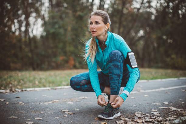 istock Woman runner in park 1059250430