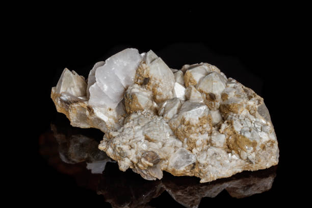 istock Macro mineral stone Snow quartz with calcite on a black background 1059250436