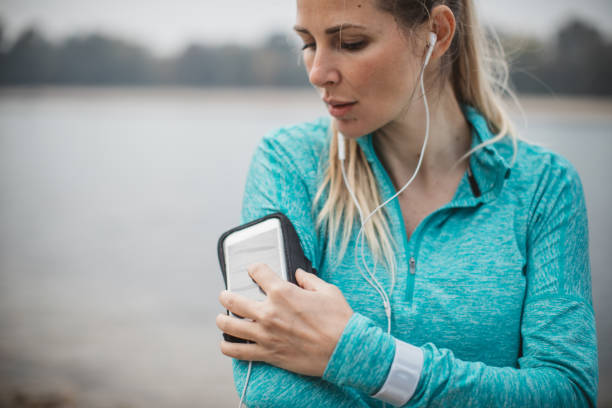 istock Woman running by the lake 1059250664