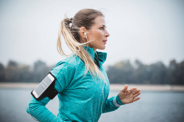 Woman running by the lake