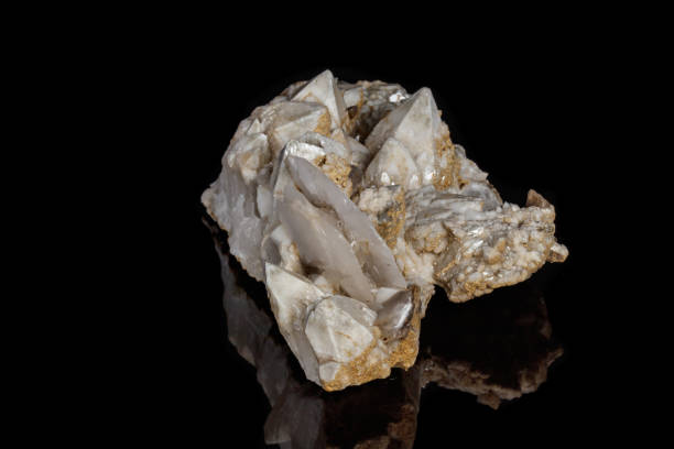 istock Macro mineral stone Snow quartz with calcite on a black background 1059251250