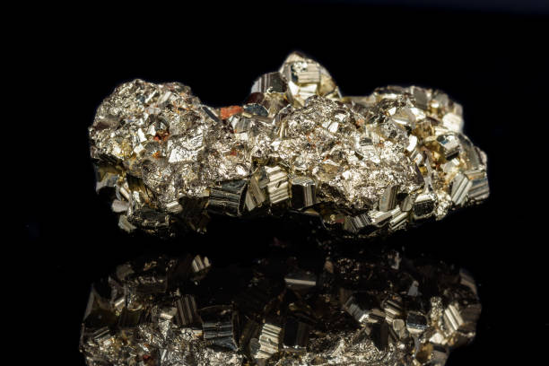 istock Macro mineral stone Pyrite on a black background 1059251446