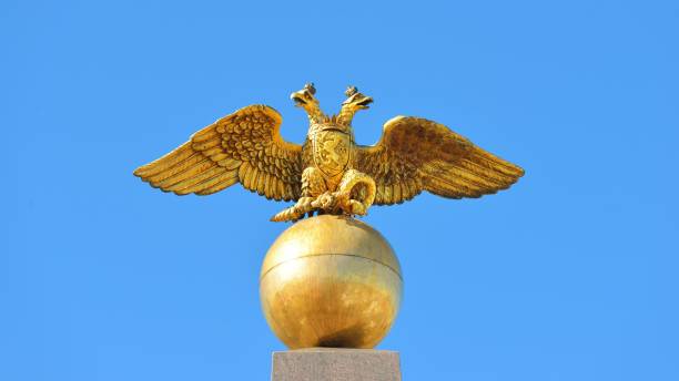 istock Two-headed Russian eagle. Golden architectural detail against blue sky. 1059251564