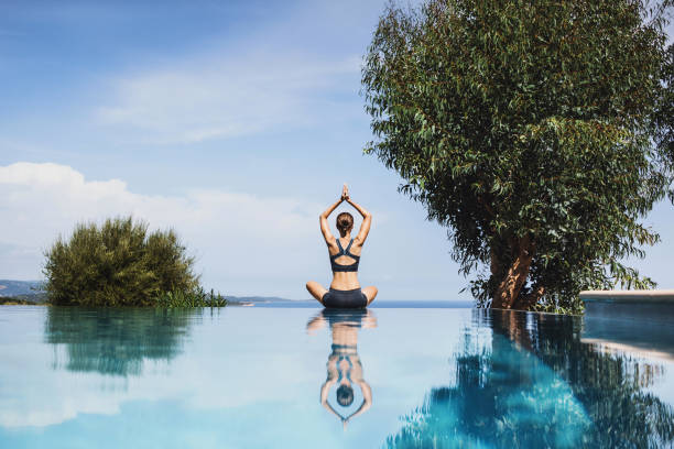 istock Woman practicing yoga. Meditation balance harmony concept 1059254064