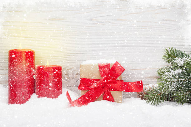 istock Christmas gift box, candles and fir tree 1059254988