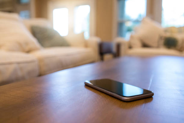 istock Mobile phone on a living room coffee table 1059257582