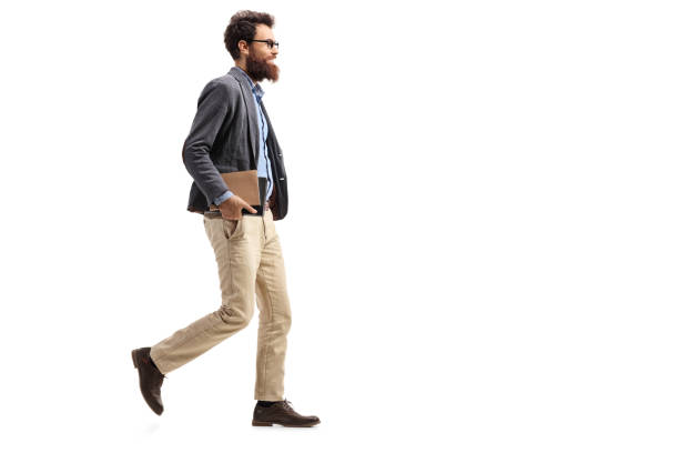 istock Man holding books and walking 1059258198