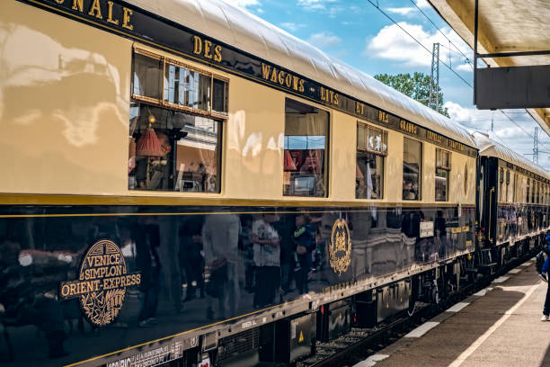 the legendary venice simplon orient express is ready to depart from ruse railway station in a cloudy day - depart imagens e fotografias de stock