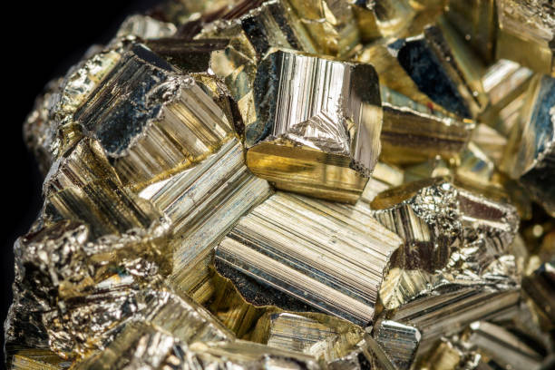 istock Macro mineral stone Pyrite on a black background 1059263232