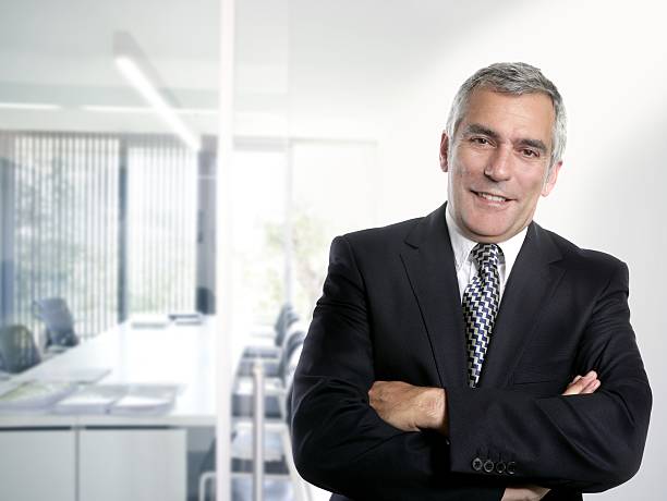 istock gray hair businessman interior white office 105926518