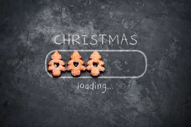 Christmas loading concept with cookies on vintage baking plate.