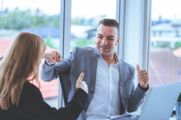 istock Boss thumb up for female worker compliment 1059268836