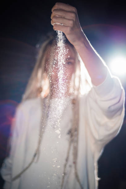 istock Young woman dropping white powder from her hand 1059270668