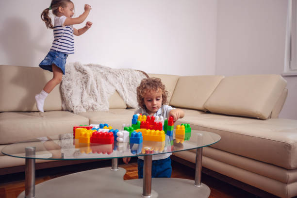 istock children play and have fun jumping on the bed. 1059272444
